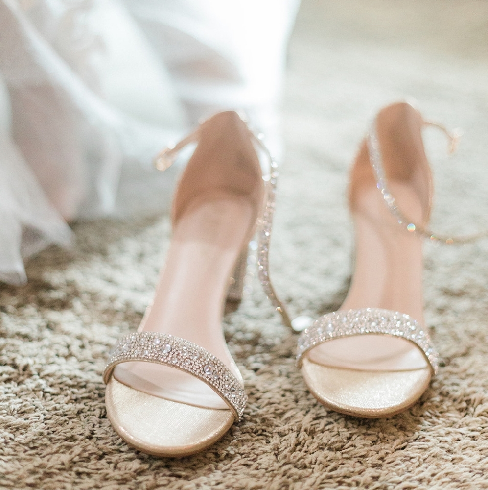 Rhinestone covered open toed heels. Great for any occasion. Worn once.